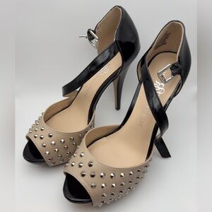 Beige and black studded heels